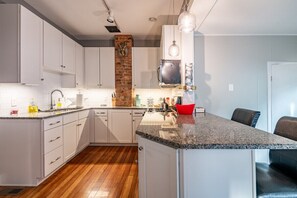 Huge, renovated kitchen with granite counters. Everything you need to fix a meal or re-heat leftovers. Stocked with cooking basics.