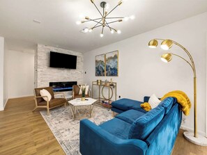 Comfortable living room with electric fireplace and bar cart