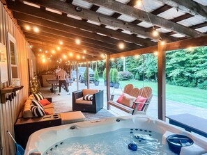 Soak, sip, swing, and serve! Whether you're in the hot tub, watching the game, lounging by the fire, or crushing your crew at ping pong or cornhole—this is your place to play.