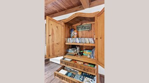 Just inside the kitchen, an armoire full of games, movies, books, and more!
