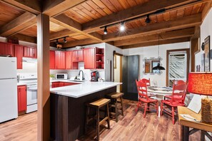 An entry view of a fully-stocked kitchen with character