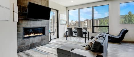 Beautiful Living Room Area With Doublewide Gas Fireplace