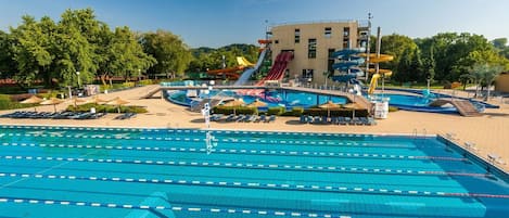 Water, Plant, Sky, Swimming Pool, Cloud, Tree, Outdoor Furniture, Shade, Building, Leisure