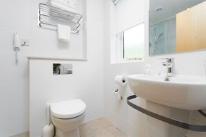A modern and streamlined bathroom, designed for ease and simplicity.