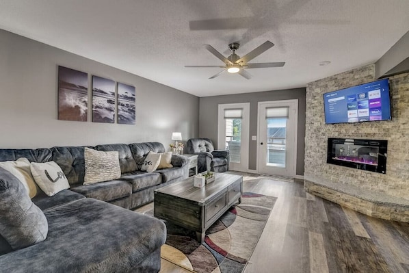 Living room with great furniture, fireplace, and roku TV