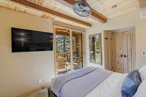 The Master Bd includes a cozy queen bed, a private deck, and a private bathroom.