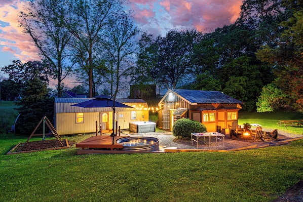 Dad is catching the game on the 100" projector screen, you're enjoying a glass of wine in the hot tub with your sis, Mom & Brother are laughing by the fire pit & the dogs are roaming 2 acres! Nashville Urban Acreage for video tours & more!