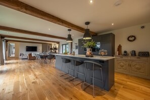 The Hayloft, Felbrigg: Open-plan living area featuring kitchen with breakfast bar, dining area and snug