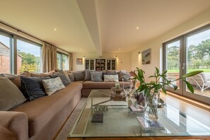 The Hayloft, Felbrigg: The light and airy sitting room with wood burning stove