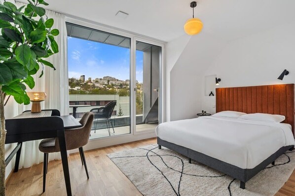 Wake up to stunning city views in this bright, modern bedroom. Direct bookings: www.arcaproperties.lu