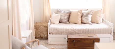 Living room w daybed. Loft above.