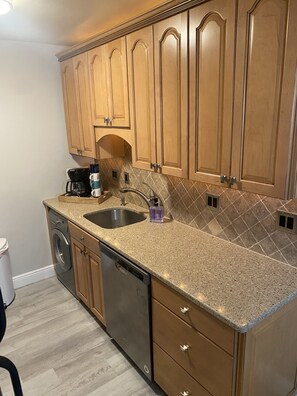 Kitchen comes with appliances to cook and enjoy staying home. 