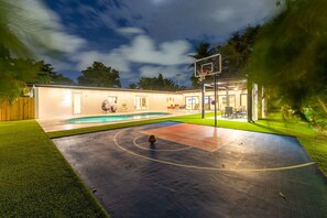Cool basketball court next to the covered terrace.