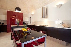 Large kitchen with custom cabinets and high end appliances