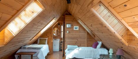 Enjoy a cozy "cabin-like" upstairs suite with skylights throughout!