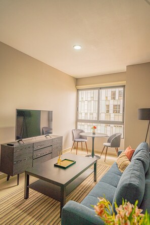 Living space with dinning table. Great place to relax or work 