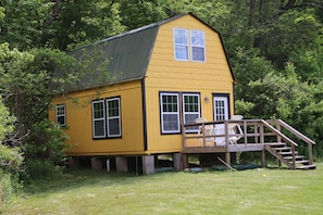 Tucked into the edge of the woods