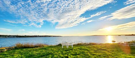 View of the sunset from the home. 
*Waterfront beach access w/ fire pit