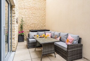 You also have a private patio complete with comfy outdoor furniture for those warmer evenings. 