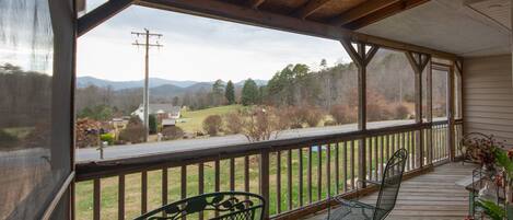 Enjoy the mountains and sunsets from the large screened in porch. 