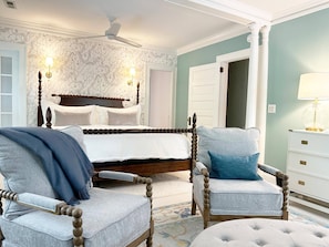 Primary bedroom has king Casper bed, sitting area, Smart TV, and en-suite bath.