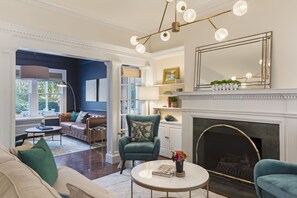 Living Room with conversational furniture and gas logs.