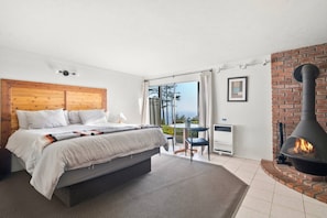 Room #2 with ocean views and classic Malm fireplace.