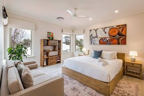 Wake up to breathtaking coastal scenery from this tranquil upstairs retreat. The primary bedroom comes with a king bed, a lounge and ensuite bathroom.