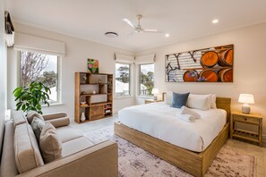 Wake up to breathtaking coastal scenery from this tranquil upstairs retreat. The primary bedroom comes with a king bed, a lounge and ensuite bathroom.
