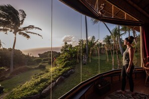 Panoramic views from the bamboo temple offer serene sunset vistas.