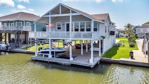 This home is perfectly situated right on the water.