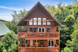 Nestled in the mountainside, enjoy infinite VIEWS from main-level or lower-level decks!
