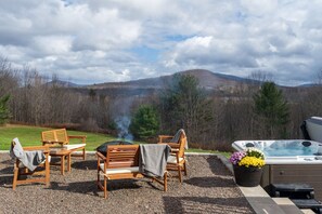 New patio, fire pit and hot tub overlooking the rolling hills.