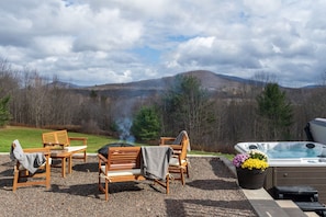 New patio, fire pit and hot tub overlooking the rolling hills.