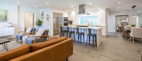 Kitchen with fantastic bar seating attached to the living room.