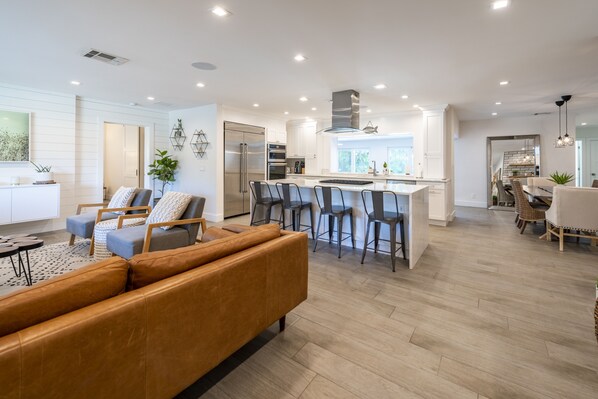 Kitchen with fantastic bar seating attached to the living room.