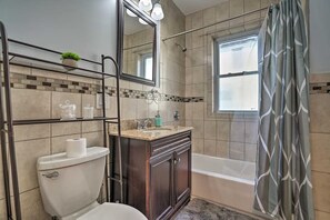 Stunning full bathroom with spacious bathtub and rain shower!