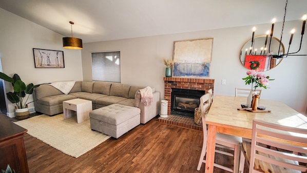 Open concept living and dining area comfortably seats 6