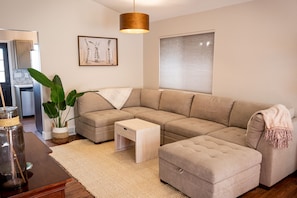 Large, plush sectional. Extra pillows and blankets provided