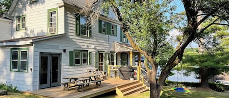 Deck leading from the kitchen via french door.  Summer BBQs on new Weber grill.