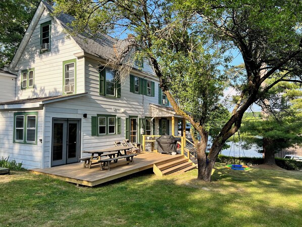 Deck leading from the kitchen via french door.  Summer BBQs on new Weber grill.