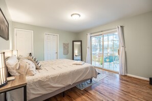 Master bedroom on the main floor with king size bed and access to top deck 