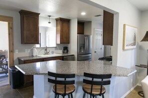 The kitchen is a great size for prepping & cooking, has a bar area for seating.