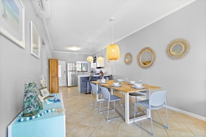 Charming Kitchen and Dining Area of the Apartment in Noord Aruba - Spacious open-plan design for a modern feel - Ample natural light through large windows - Elegant Decor