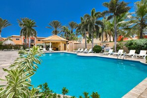 Shared pool with lounge chairs to soak up the sun