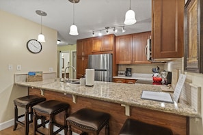 Fully stocked newly remodeled kitchen with new granite counters and cabinets