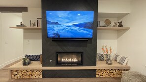 Fireplace and big screen TV/Sonos sound bar.