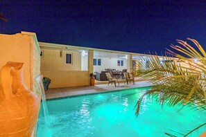 Find peace in the tranquil waters of our pool area, embracing the serenity of the night.