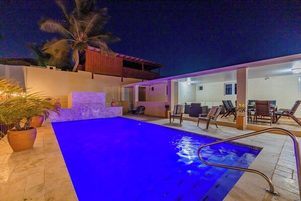 Under the Moonlit Sky! Dive into relaxation as the pool area comes alive with enchanting night vibes.