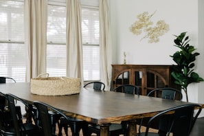 The dining room table can easily accommodate the group for a gourmet meal.